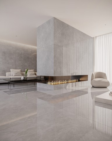 Sala de estar moderna e luxuosa revestida com porcelanatos grandes formatos em tom cinza claro polido no piso, paredes e na estrutura de uma lareira central linear.