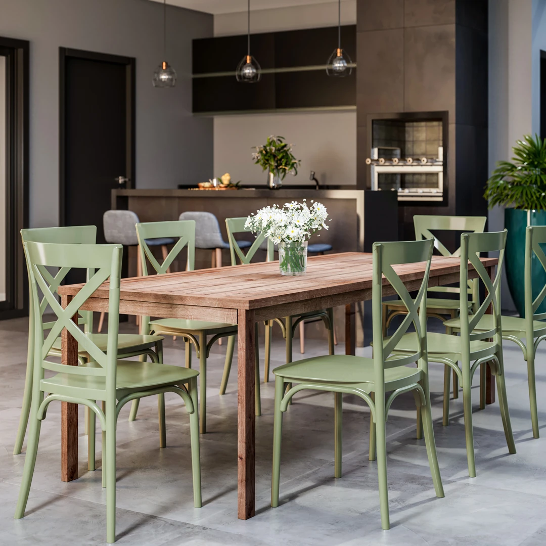 Área de lazer moderna com mesa retangular de madeira e oito cadeiras de plástico verde com design clássico e encosto cruzado. Área de lazer moderna com mesa retangular de madeira e oito cadeiras de plástico verde com design clássico e encosto cruzado.